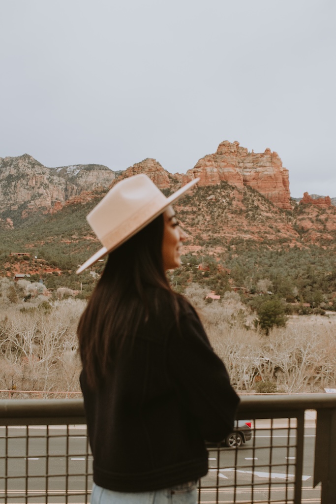 girl standing in front of red rocks in sedona for the perfect weekend escape, 2 day sedona itinerary