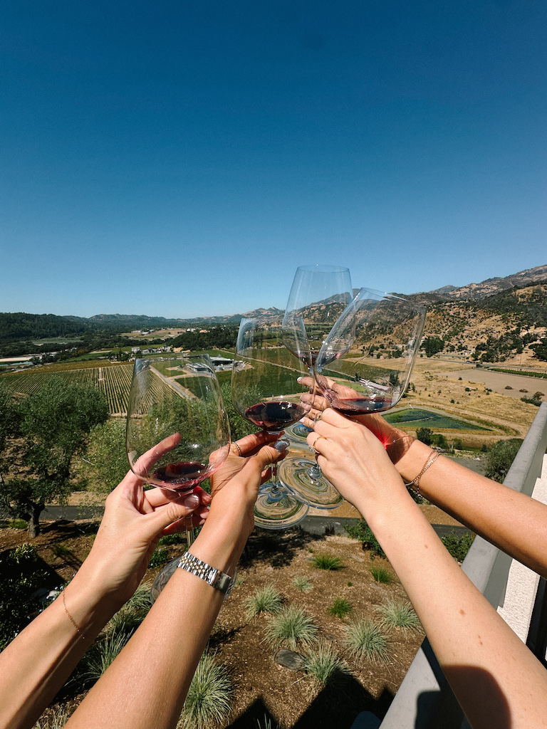 girls cheersing in napa valley for a fun 3 day napa valley itinerary